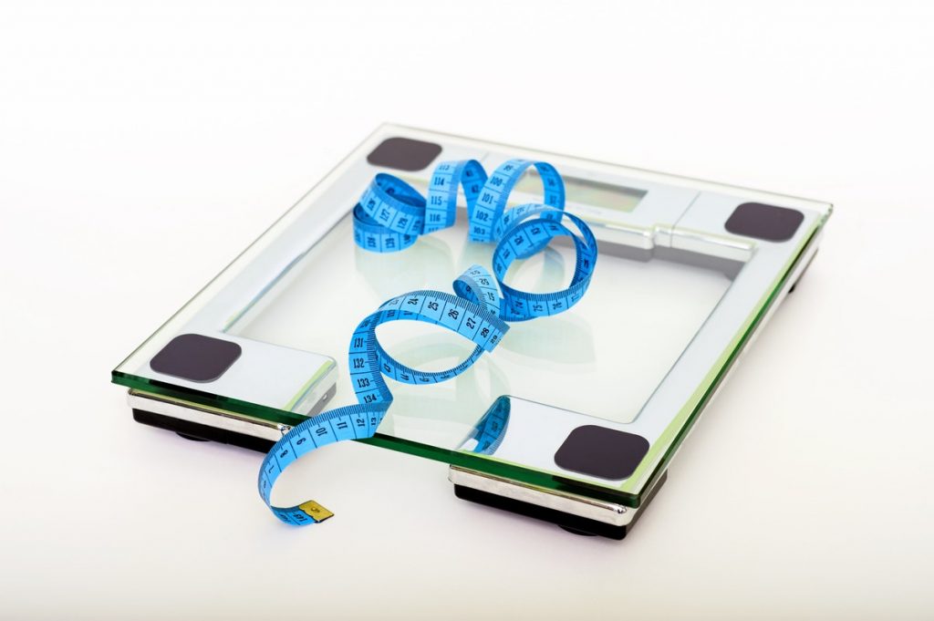 weighing scale and tape measure for weight loss